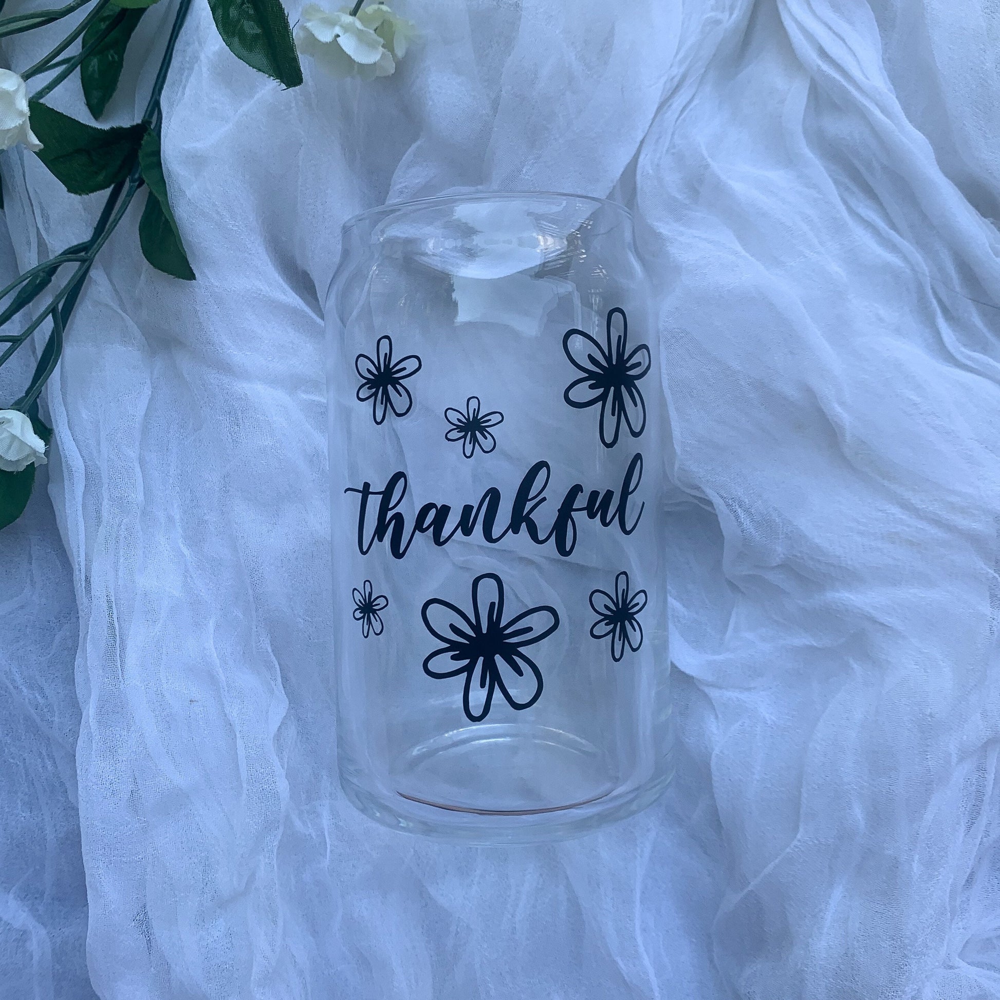 Thankful glass cup on a white background.